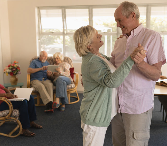 An image of two seniors dancing.